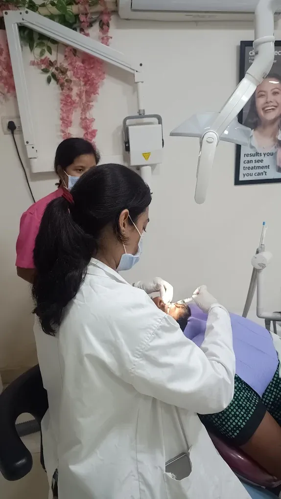 Dr. Shabnam and her assistant treating a patient at The Tooth Corner