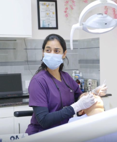 Dr. Shabnam gently treating a patient at The Tooth Corner