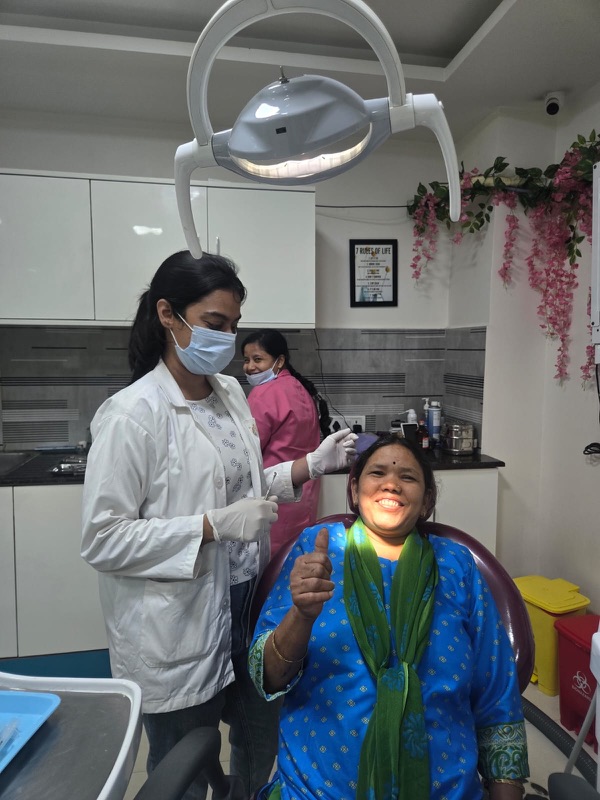 A happy patient giving a thumbs up after treatment at The Tooth Corner, Bellandur