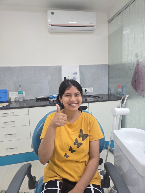 A happy patient giving a thumbs up after treatment at The Tooth Corner, Bellandur