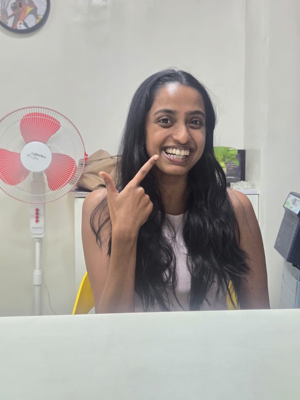 A happy patient giving a thumbs up after treatment at The Tooth Corner, Bellandur