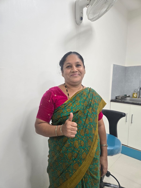 A happy patient giving a thumbs up after treatment at The Tooth Corner, Bellandur