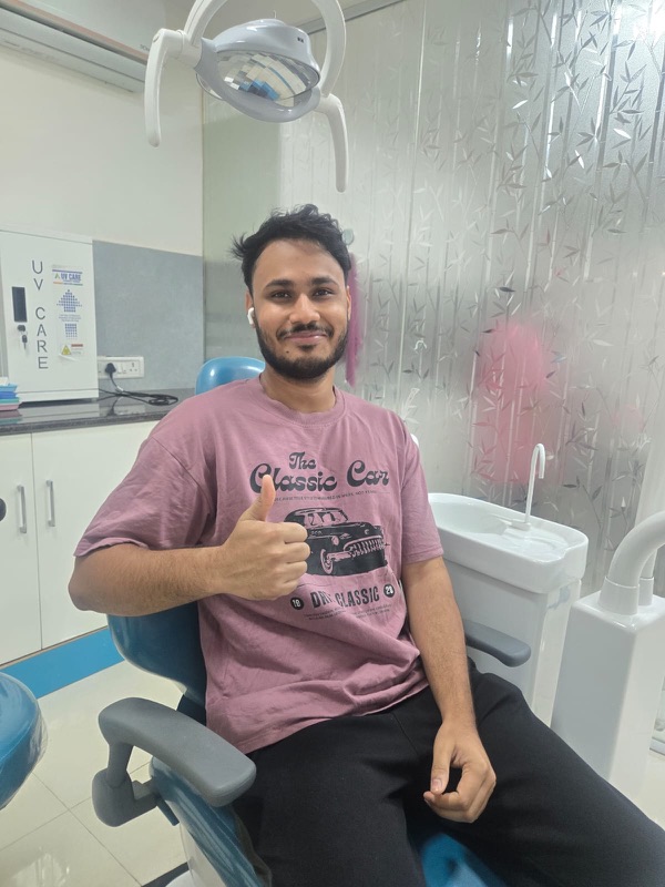 A happy patient giving a thumbs up after treatment at The Tooth Corner