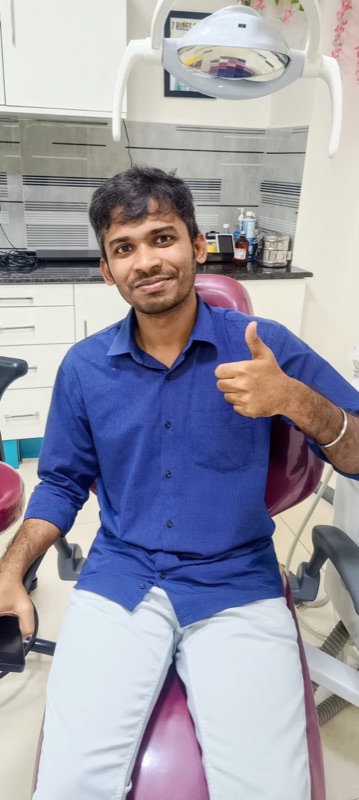 A happy patient giving a thumbs up after treatment at The Tooth Corner, Bellandur